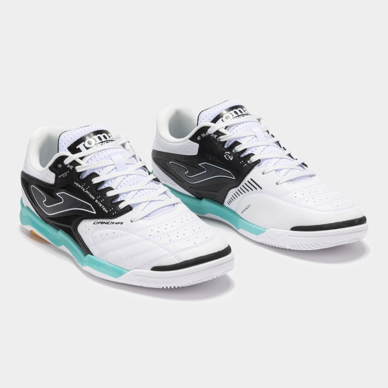Pair of JOMA Cancha 2502 futsal shoes showing breathable mesh and streamlined shape.