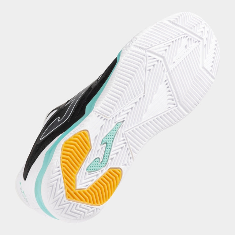 Underside of the JOMA Cancha 2502 showing FLEXO sole lines and grippy indoor pattern.